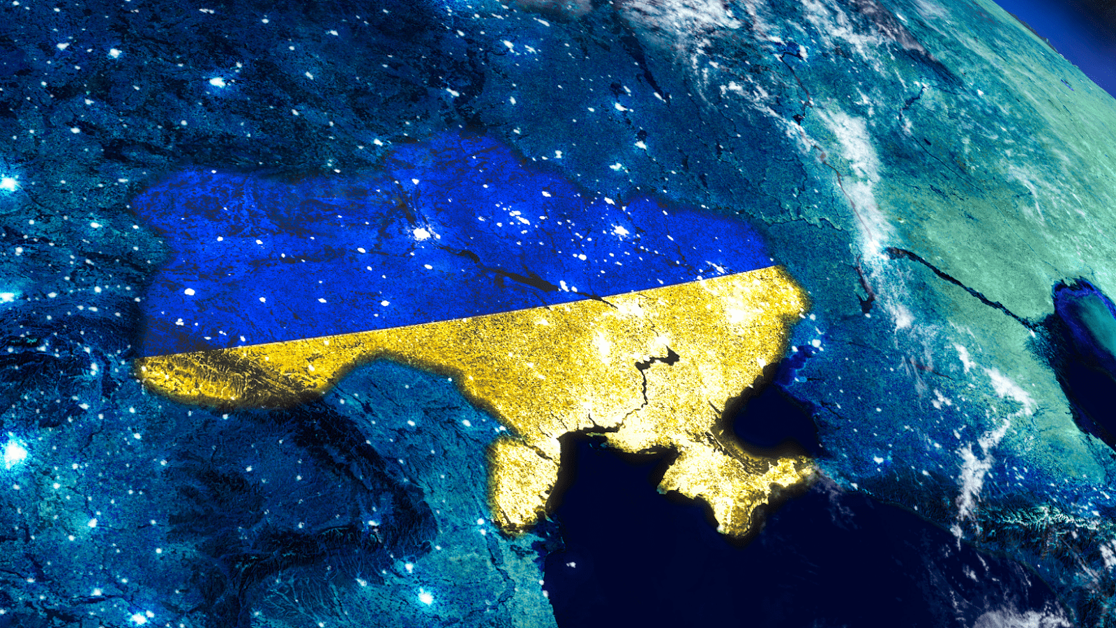Sattelite image of Ukraine at night with Ukrainian flag superimposed over the country's borders
